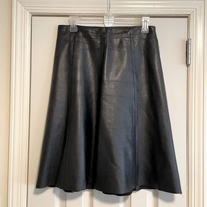 Mid-length black leather skirt